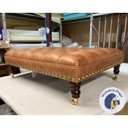 Glenmore Deep Buttoned Footstool with Border 102 x 76cm (40 x 30") Antique Matt Leather Bridle - Gold Full Strud Trim - 7ins Castor Mahogany Leg 8801 Glenmore Deep Buttoned Footstool with Border 102 x 76cm (40 x 30") Antique Matt Leather Bridle - Gold Full Strud Trim - 7ins Castor Mahogany Leg 8801