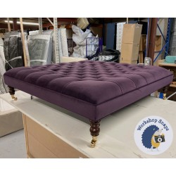 Glenmore Deep Buttoned Footstool with Border 122 x 122cm (48 x 48") JBrown Amalfi Heather - Single Piped Trim - 7ins Castor Mahogany Leg 8039 Glenmore Deep Buttoned Footstool with Border 122 x 122cm (48 x 48") JBrown Amalfi Heather - Single Piped Trim - 7ins Castor Mahogany Leg 8039
